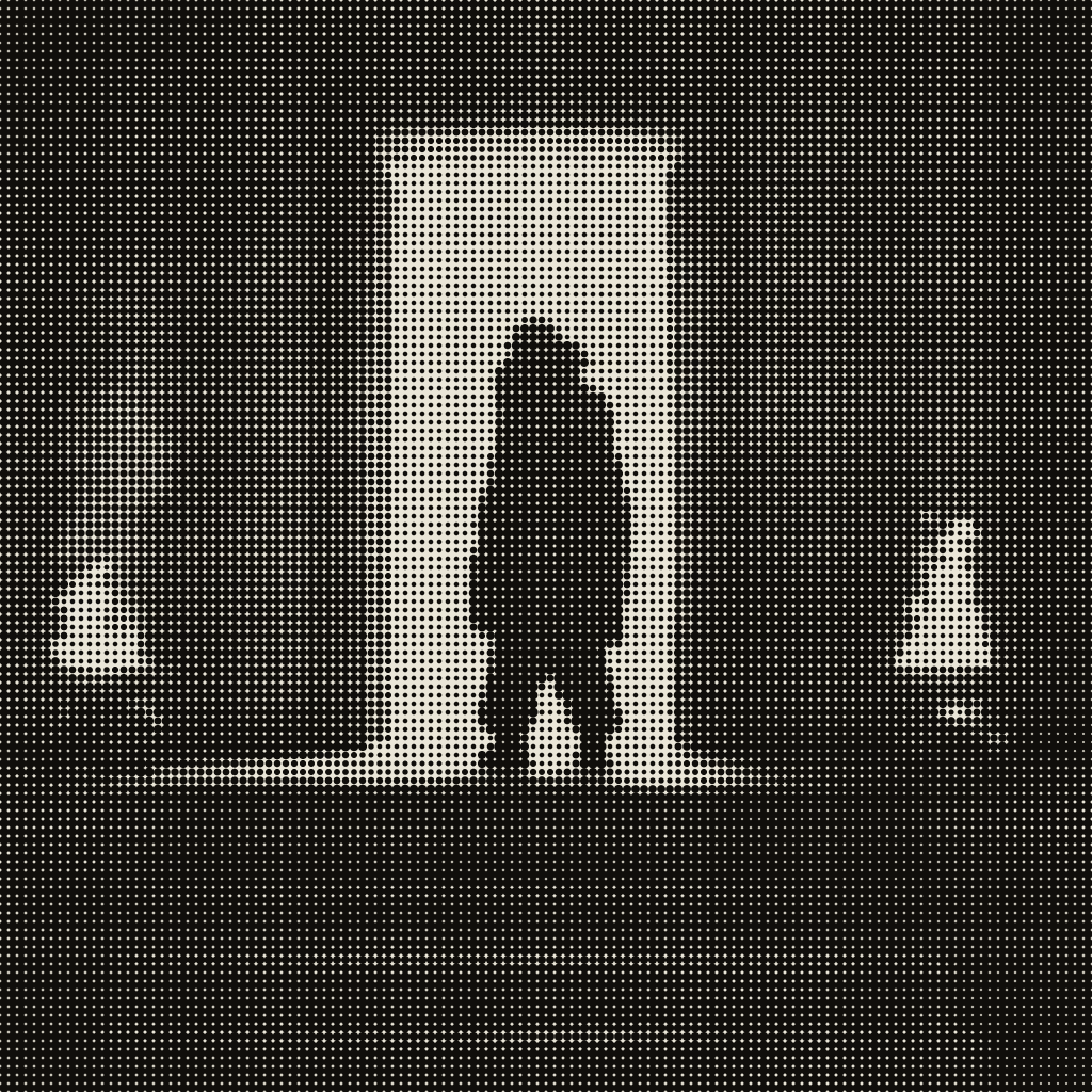 A silhouetted figure standing in a bright doorway